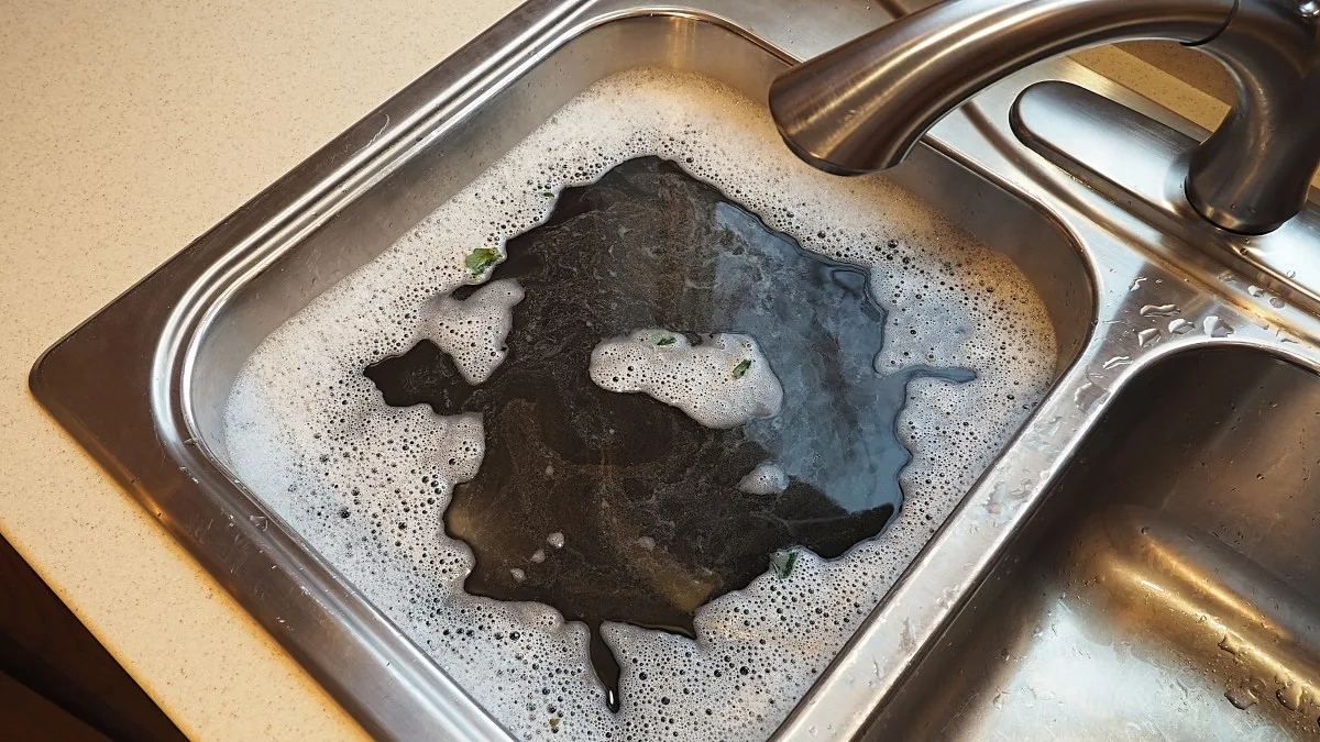 how to clear a clogged kitchen sink